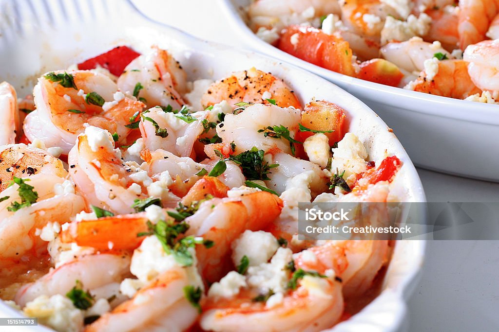 roasted shrimp with tomatoes and feta cheese shot of roasted shrimp with tomatoes and feta cheese Roasted Stock Photo