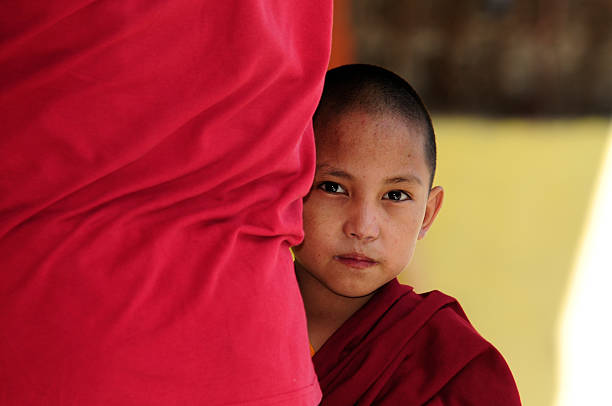 Little boy monk standing behind, Janangpa School, Nepal