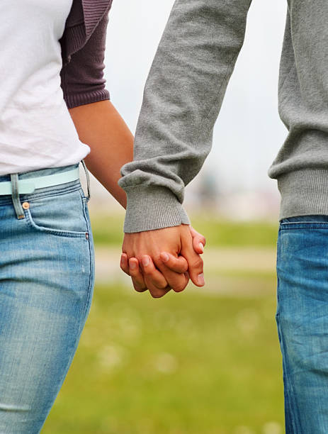 istock Midsection of a couple holding hands 151515996