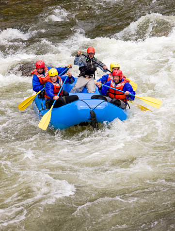 Group of four people with guide river rafting in Buena Vista, Colorado USA.
