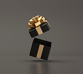 Black open gift box with gold ribbon