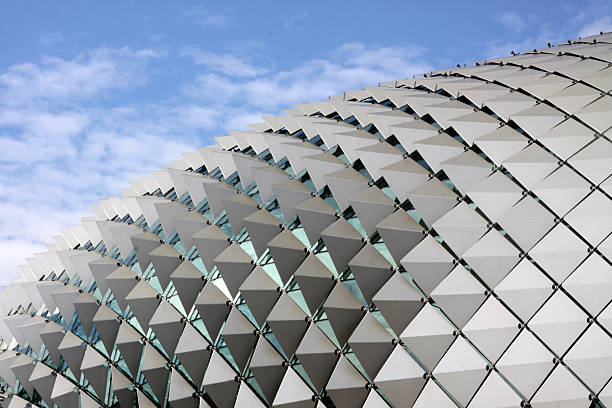 Futuristic opera house roof against blue sky