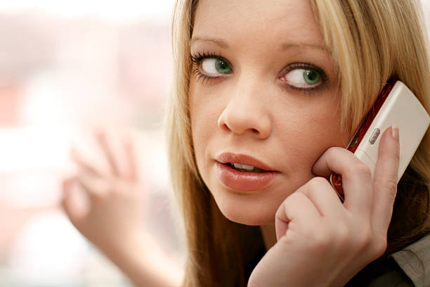 Young women on cell phone stock photo