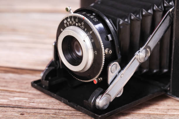istock Retro camera on a wooden table 1515198333