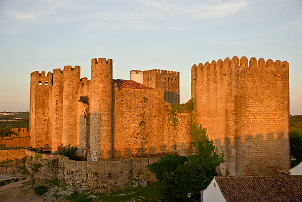 castle in Obidos Ancient castle in Obidos, Portugal at sunset obidos photos stock pictures, royalty-free photos & images