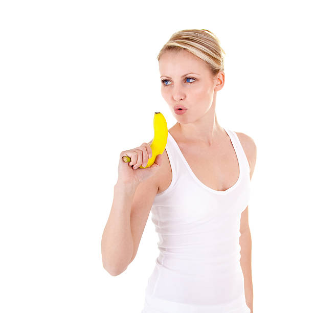 Young woman and banana stock photo
