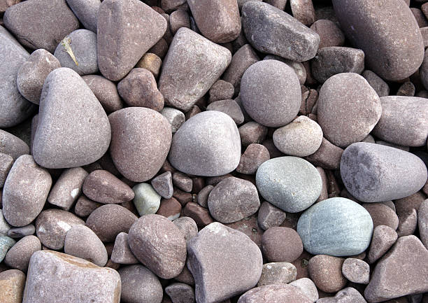 rounded pebbles on the beach stock photo