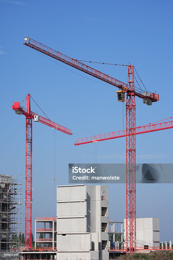 Tre gru sul Cantiere di costruzione - Foto stock royalty-free di Acciaio