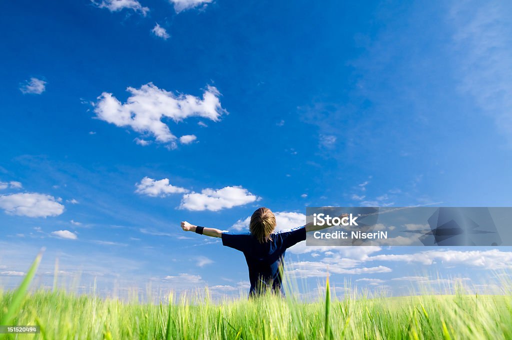 Happy man with arms up Happy man with arms up on summer field One Person Stock Photo