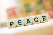 PEACE Spelled With Scrabble Tiles