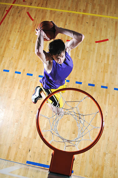 istock basket ball game player at sport hall 151522051