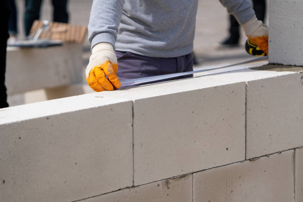 istock The bricklayer works to measure. Measuring with a meter 1515231292
