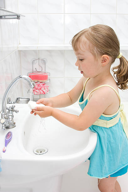 istock little girl in bathroom 151523218