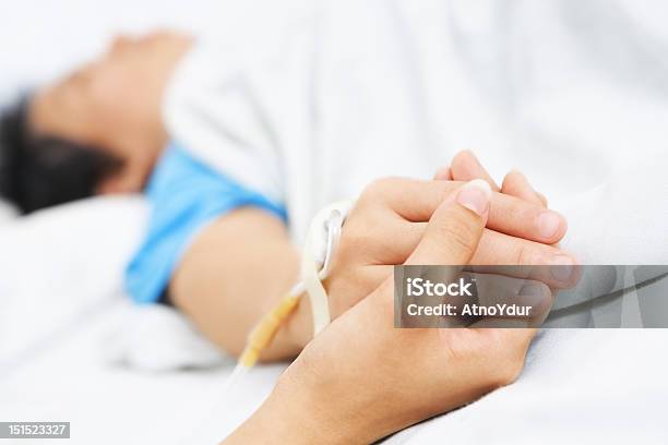 Holding Patient Hand In Hospital Stock Photo - Download Image Now - Affectionate, Bed - Furniture, Care