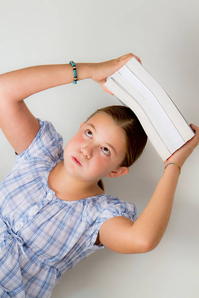 istock Teen student crushed by books 151523445