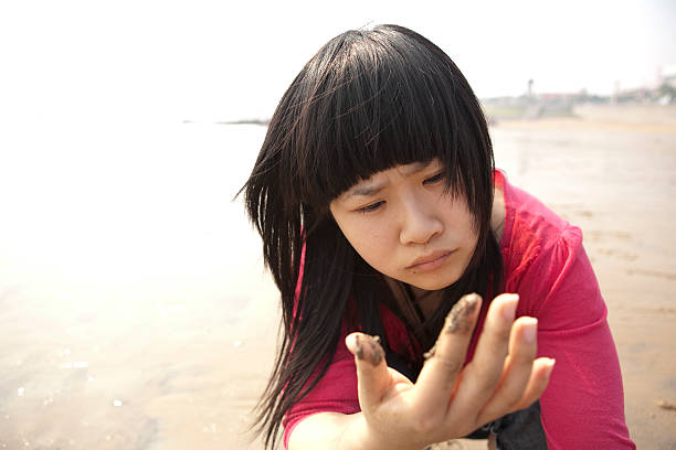 Confused chinese girl stock photo