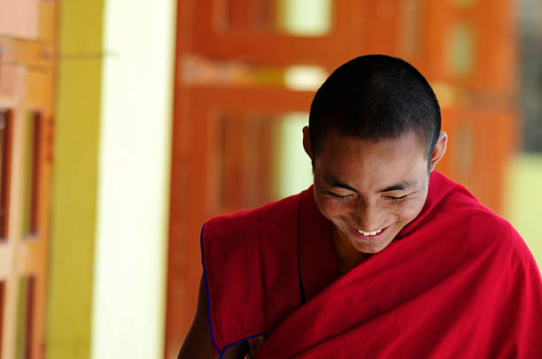 Student monk bowing at Jonangpa School in Kathmandu, Nepal stock photo