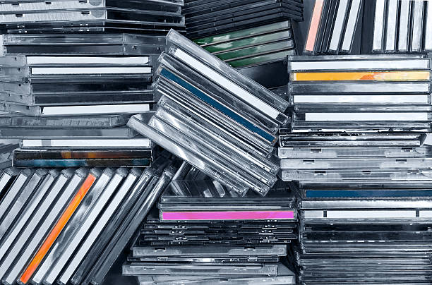 CDs in shelf Piles of CDs in a shelf. compact disc stock pictures, royalty-free photos & images