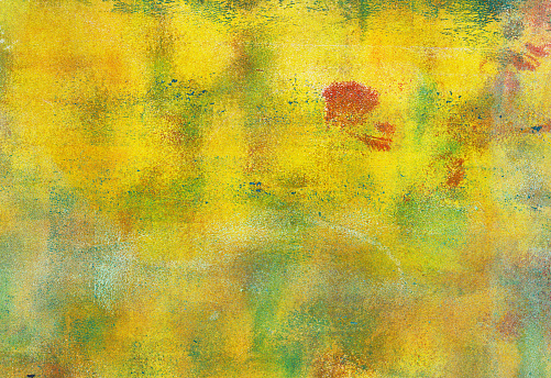 Hand painted background with colors of yellow and green.
