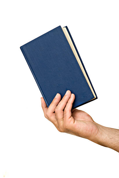 istock Hand with book isolated on white background 151526228