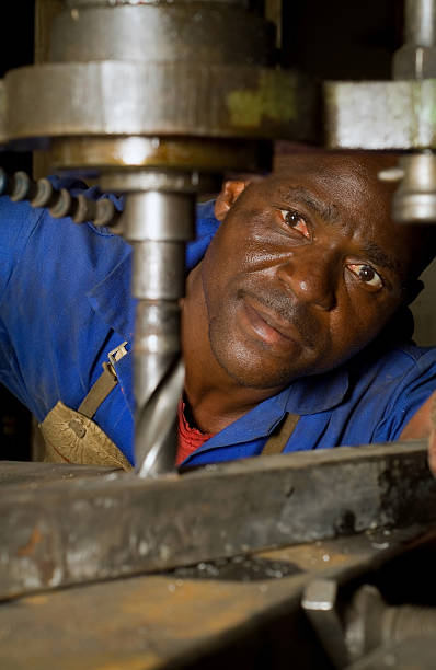 istock African American with drill press 151526765