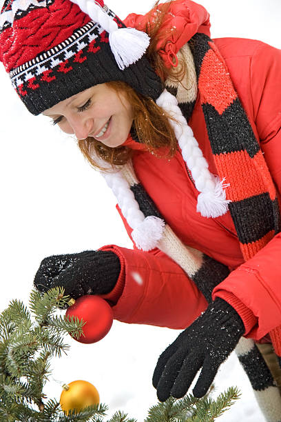 istock attractive girl with Christmas tree 151526955