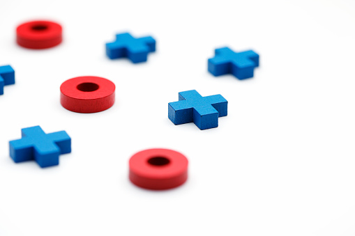 Red and blue tic-tac-toe pieces
