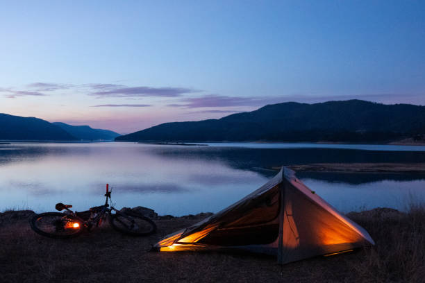 istock People and nature. Tent camping at lakeshore. 1515273732