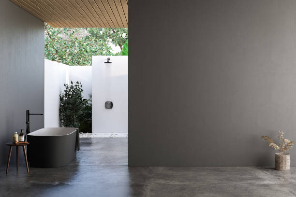 istock Modern bathroom interior with dark walls, marble basin with double mirror, bathtub, open air shower and grey concrete floor. Minimalist black bathroom with modern furniture. 3D rendering 1515281645