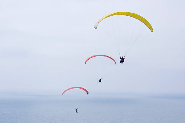 istock tandem paragliders over the ocean 151528359