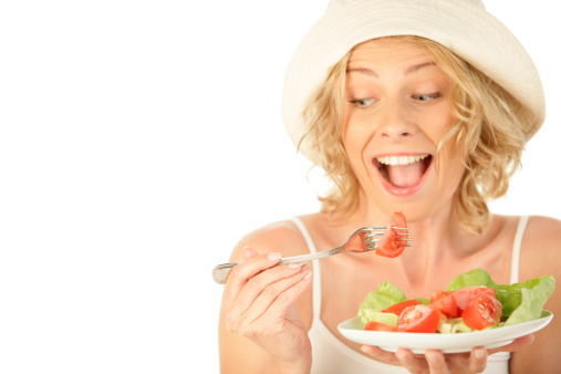 young woman having spaghetti