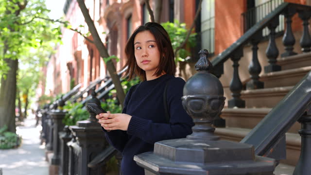Asian Student Finds Solitude on a West Village Doorway in NYC