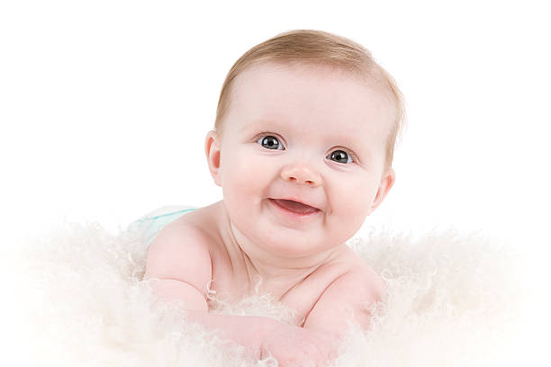 istock Adorable smiling baby on fluffy cushion. 151529520