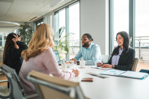 istock Mid Adult Multi-Ethnic Company Managers at a Meeting Table 1515302009