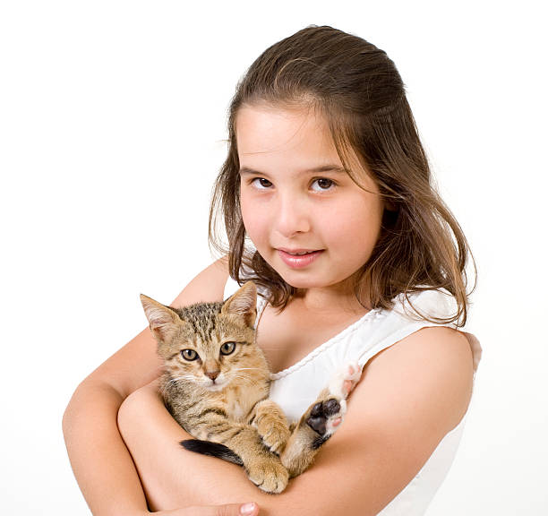 istock little girl holding a kitten 151531174