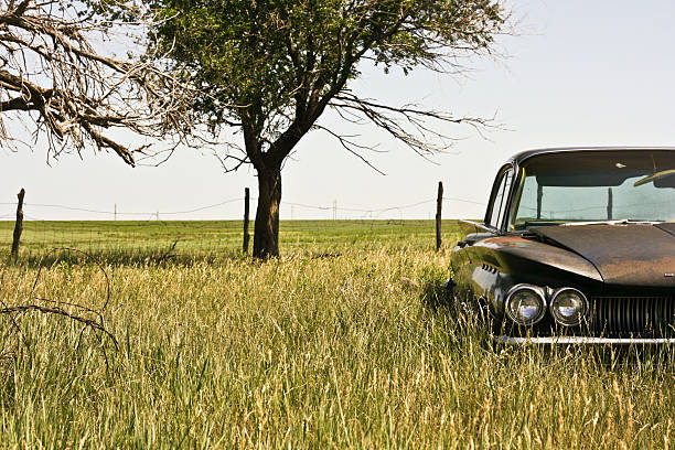 istock Vintage car left in a field 151531566