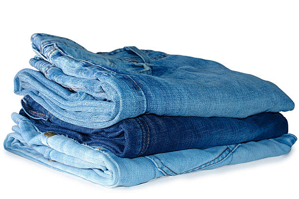 Stack of blue jeans outerwear. stock photo
