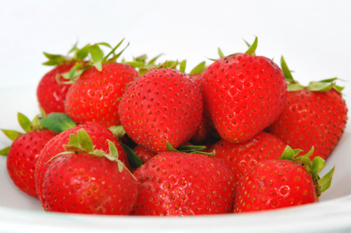 A plate of red strawberries