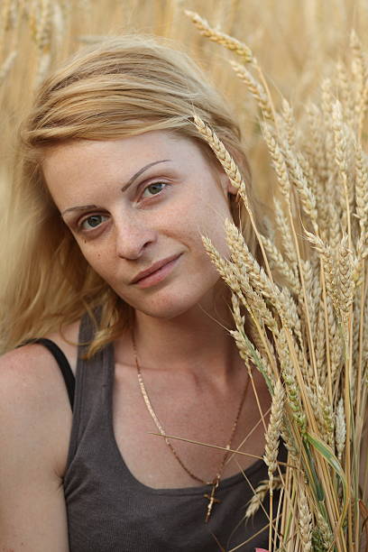 Woman and grain stock photo