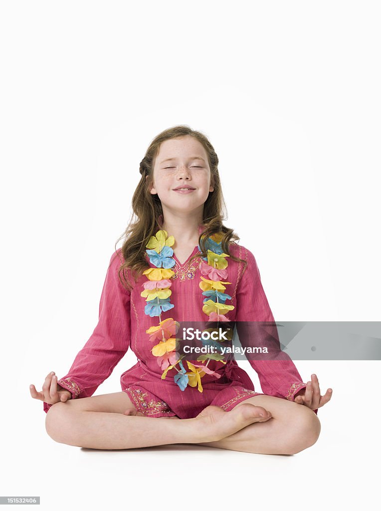 Pretty, young girl wearing kaftan in relaxed yoga pose Young girl dressed in pink kaftan sitting in half lotus with eyes closed and hands in mudra. Please look at my portfolio for more images with this model against a white background. Barefoot Stock Photo