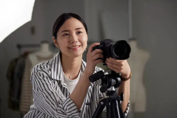 Japanese young woman working as a photographer