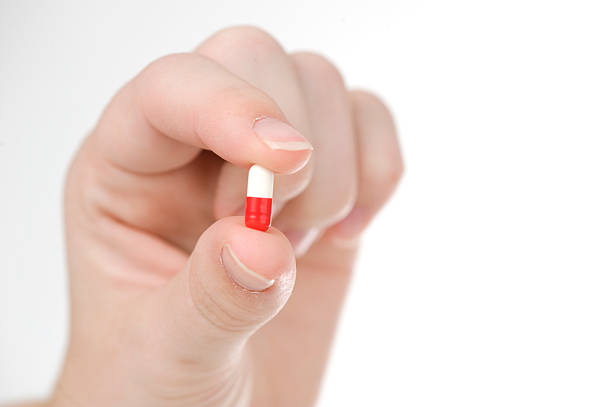 istock Medicine Pills with human hand 151532526