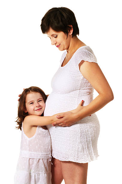 istock little girl hugging new sibling 151533292