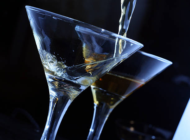martini pouring in glass stock photo
