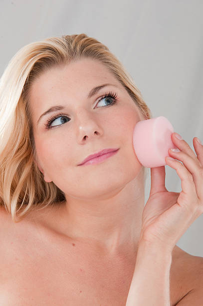 Removing make-up from skin stock photo