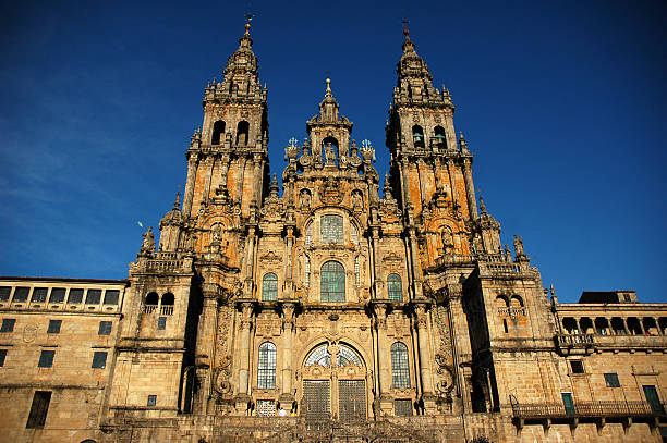 Cathedral of Santiago de Compostela Front of Cathedral of Santiago de Compostela (Galicia-Spain) in the Obradoiro Square. Construction of the present cathedral began in 1075 under the reign of Alfonso VI of Castile (1040-1109) and the patronage of bishop Diego PelA!ez. It was built according to the same plan as the monastic brick church of Saint Sernin in Toulouse, probably the greatest Romanesque edifice in France. It was built mostly in granite. Construction was halted several times and, according to the Liber Sancti Iacobi, the last stone was laid in 1122. But by then, the construction of the cathedral was certainly not finished. The cathedral was consecrated in 1128 in the presence of king Alfonso IX of Leon. (More information in Wikipedia) santiago de compostela stock pictures, royalty-free photos & images