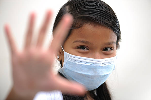 istock girl wear mask 151534704