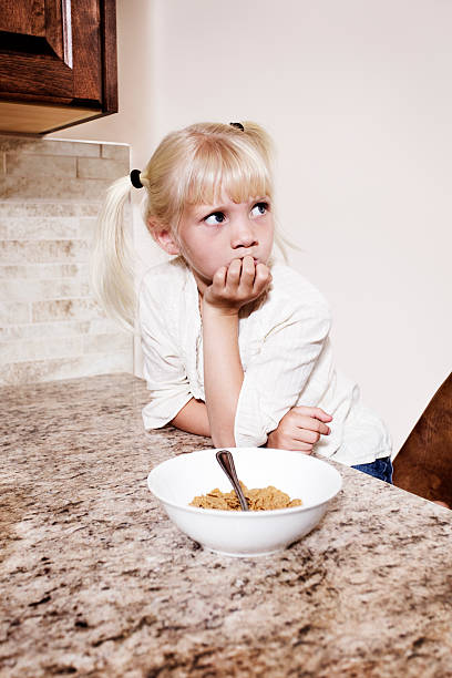 Confused little girl stock photo