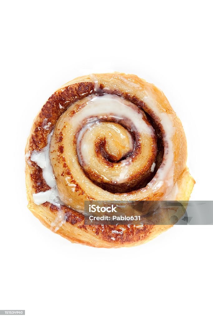 Cinnamon Breakfast Bun A sweet morning treat shot from above isolated on a white background Cinnamon Bun Stock Photo