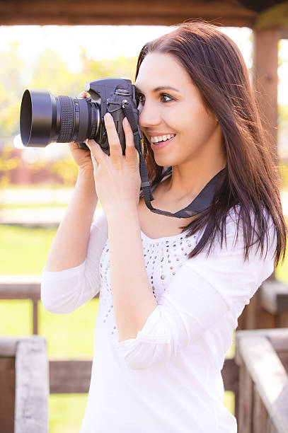 istock Beautiful girl with camera 151535611